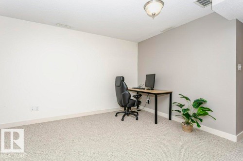 Office space featuring carpet and baseboards - 1381 Rutherford Road, Edmonton, AB - Indoor