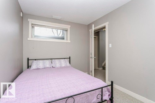 Bedroom featuring light colored carpet and a textured ceiling - 1381 Rutherford Road, Edmonton, AB - Indoor Photo Showing Bedroom