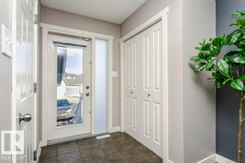 Foyer entrance featuring baseboards and a textured ceiling - 1381 Rutherford Road, Edmonton, AB - Indoor Photo Showing Other Room