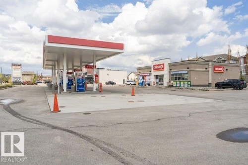 View of commercial property with uncovered parking - 1381 Rutherford Road, Edmonton, AB - Outdoor