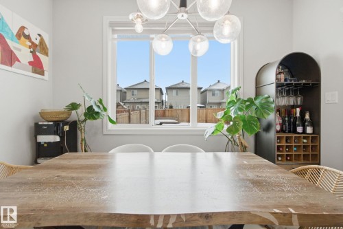 Dining space with hanging lights - 9942 222A St Nw, Edmonton, AB - Indoor Photo Showing Dining Room
