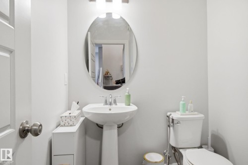 Half bathroom with toilet - 9942 222A St Nw, Edmonton, AB - Indoor Photo Showing Bathroom