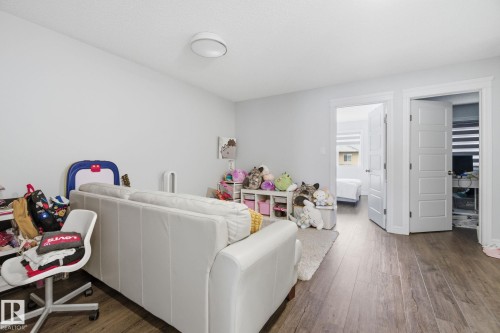 Living room featuring dark wood-style floors - 9942 222A St Nw, Edmonton, AB - Indoor