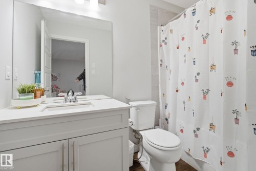 Bathroom featuring vanity and toilet - 9942 222A St Nw, Edmonton, AB - Indoor Photo Showing Bathroom