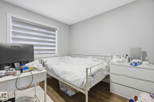 Bedroom featuring dark wood finished floors - 9942 222A St Nw, Edmonton, AB - Indoor Photo Showing Bedroom