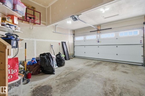 Garage featuring a garage door opener - 9942 222A St Nw, Edmonton, AB - Indoor Photo Showing Garage