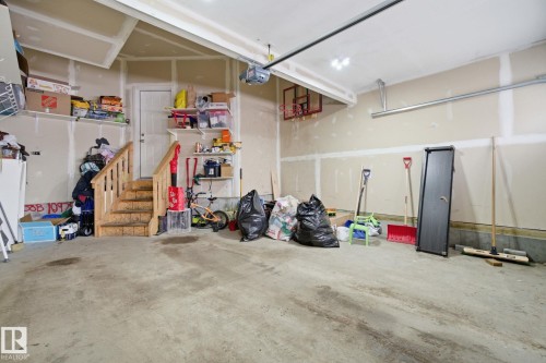 Garage with a garage door opener - 9942 222A St Nw, Edmonton, AB - Indoor Photo Showing Garage
