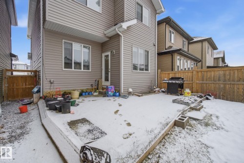 Back of property featuring a fenced backyard and a patio - 9942 222A St Nw, Edmonton, AB - Outdoor With Exterior