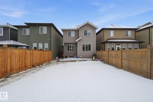 Snow covered property with a residential view - 9942 222A St Nw, Edmonton, AB - Outdoor