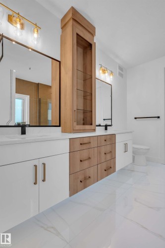 Bathroom featuring vanity and toilet - 463 Crystal Creek Link, Leduc, AB - Indoor
