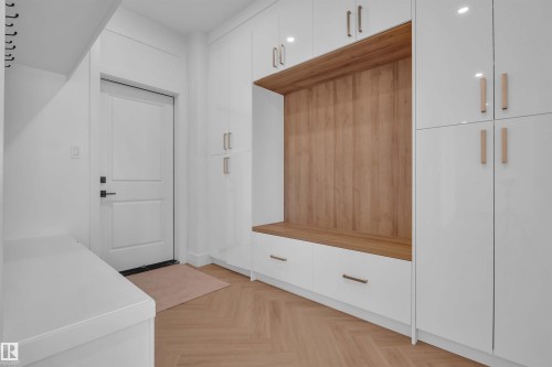 Mudroom featuring parquet floors - 463 Crystal Creek Link, Leduc, AB - Indoor Photo Showing Other Room