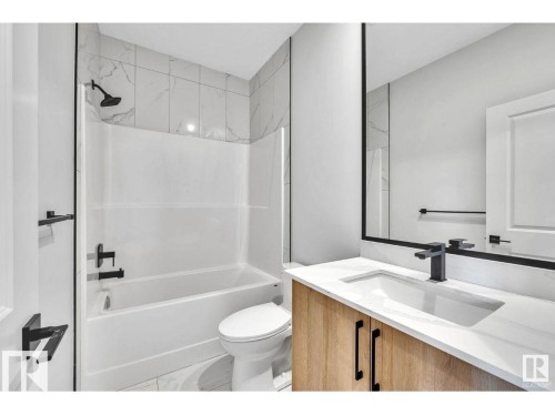 Bathroom with vanity and tub / shower combination - 426 Crystal Creek Link, Leduc, AB - Indoor Photo Showing Bathroom
