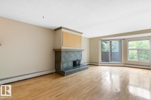 11122 83 Avenue, Edmonton, AB - Indoor Photo Showing Living Room With Fireplace