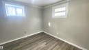 Unfurnished room with wood finished floors and ornamental molding - 12139 81 Street, Edmonton, AB  - Indoor Photo Showing Other Room 