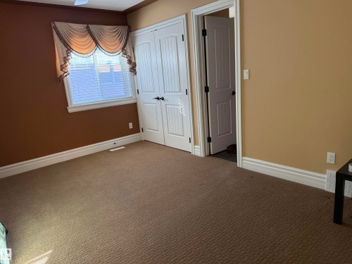 Unfurnished bedroom featuring carpet and a closet - 816 Wildwood Crescent Nw, Edmonton, AB - Indoor Photo Showing Other Room