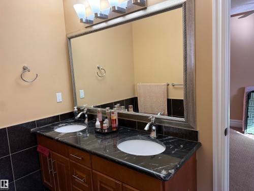 Full bathroom with double vanity and tile walls - 816 Wildwood Crescent Nw, Edmonton, AB - Indoor Photo Showing Bathroom