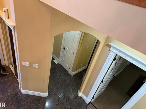 Hall with arched walkways and granite tiled floors - 816 Wildwood Crescent Nw, Edmonton, AB - Indoor Photo Showing Other Room