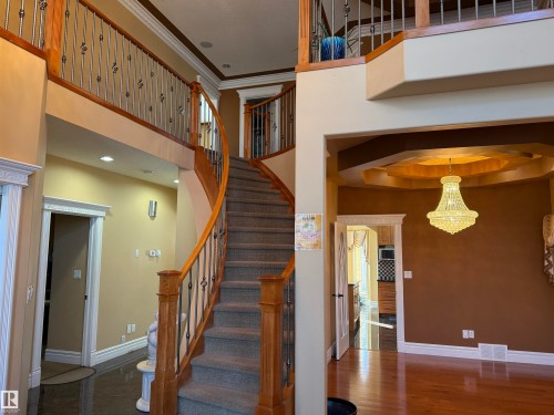 Stairs featuring ornamental molding, a high ceiling, and recessed lighting - 816 Wildwood Crescent Nw, Edmonton, AB - Indoor Photo Showing Other Room