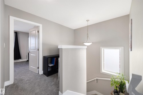 Corridor featuring an upstairs landing and carpet - 81 Richmond Link, Fort Saskatchewan, AB - Indoor
