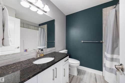 Bathroom featuring vanity and a shower with shower curtain - 81 Richmond Link, Fort Saskatchewan, AB - Indoor Photo Showing Bathroom
