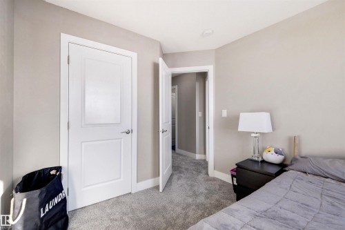 Carpeted bedroom with baseboards - 81 Richmond Link, Fort Saskatchewan, AB - Indoor Photo Showing Bedroom