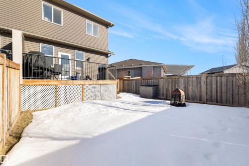 Back of property featuring a fenced backyard and a deck - 81 Richmond Link, Fort Saskatchewan, AB - Outdoor With Exterior