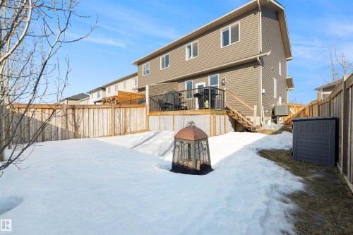 Rear view of house featuring a deck and a fenced backyard - 81 Richmond Link, Fort Saskatchewan, AB - Outdoor With Deck Patio Veranda
