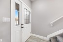 Doorway to outside featuring baseboards - 81 Richmond Link, Fort Saskatchewan, AB  - Indoor Photo Showing Other Room 