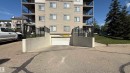 View of apartment building / complex with an attached garage and asphalt driveway - 133 301 Clareview Station Drive, Edmonton, AB  - Outdoor With Exterior 