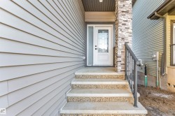 Entrance to property with stone siding - 
