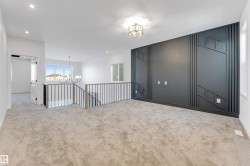 Empty room with a chandelier, carpet, and recessed lighting - 