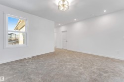 Carpeted spare room with recessed lighting - 
