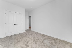 Unfurnished bedroom with carpet floors and a closet - 
