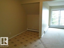 Additional living space with a baseboard heating unit and baseboards - 