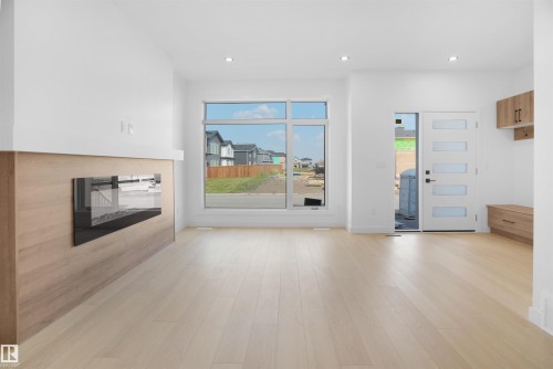84 Blackbird Bend, Fort Saskatchewan, AB - Indoor Photo Showing Other Room With Fireplace