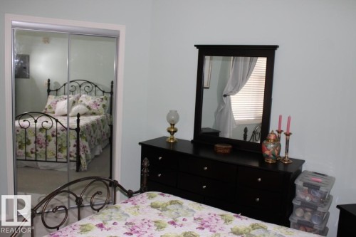 Bedroom with a closet - 330 4831 104A Street, Edmonton, AB - Indoor Photo Showing Bedroom