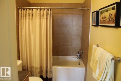 Bathroom with shower / tub combo and vanity - 330 4831 104A Street, Edmonton, AB - Indoor Photo Showing Bathroom