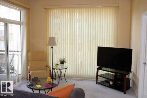 View of carpeted living room - 330 4831 104A Street, Edmonton, AB - Indoor