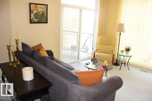 View of carpeted living room - 330 4831 104A Street, Edmonton, AB - Indoor Photo Showing Living Room