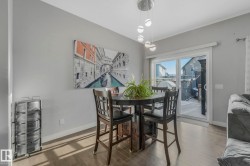 Dining room featuring wood finished floors - 