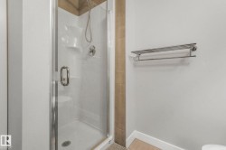 Full bath featuring a stall shower and toilet - 