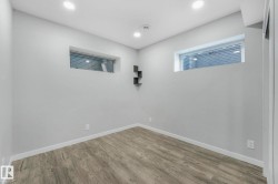 Spare room featuring wood finished floors and recessed lighting - 