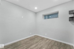 Empty room featuring baseboards and wood finished floors - 