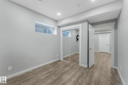 Unfurnished bedroom featuring a closet and wood finished floors - 