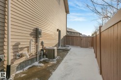 View of home's exterior with a patio and a fenced backyard - 