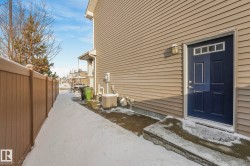 Snow covered property entrance with a patio - 