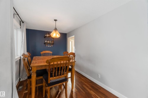 Dining area with baseboards and dark wood-style flooring - 6 Garraway Pl, St. Albert, AB - Indoor Photo Showing Dining Room