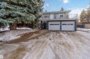 View of front of property featuring driveway and a garage - 6 Garraway Pl, St. Albert, AB  - Outdoor 