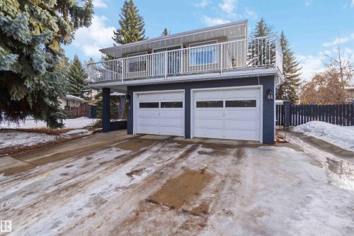 Snow covered garage with concrete driveway - 6 Garraway Pl, St. Albert, AB - Outdoor