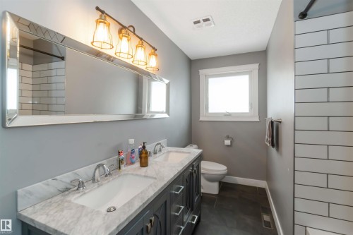 Full bathroom with double vanity and a shower - 6 Garraway Pl, St. Albert, AB - Indoor Photo Showing Bathroom